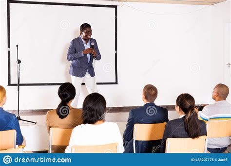 Young Emotional Male Coach Giving Motivational Speech Stock Image