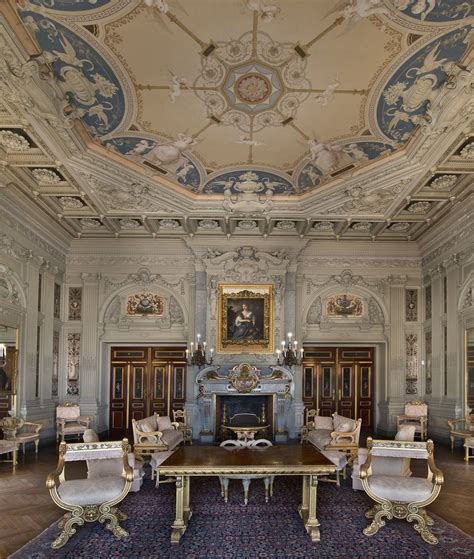 an ornately decorated room with chairs and a table