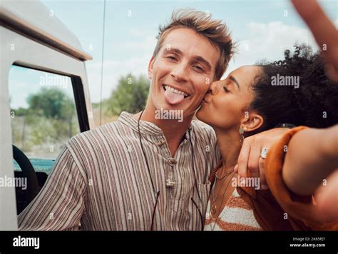 Selfie Kiss And Couple Taking A Picture On A Road Trip Having Fun On A Traveling Adventure