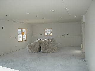 Raise the first piece of drywall to the ceiling. Basement Sheetrock - Home Drywall and Construction