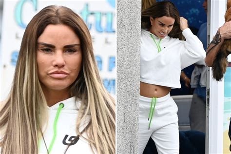 Katie Price Flashes Her Flat Stomach And Shows Off New Face After Defending Flying To Red List
