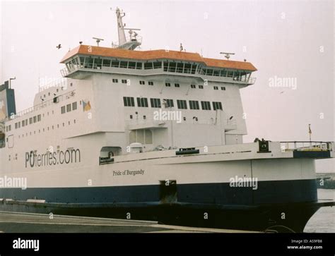 Cross Channel Ferry Unloading And Cars Waiting To Load At Calais In