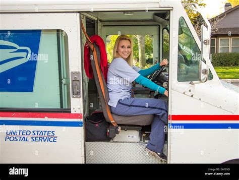 Female United States Postal Service Carrier Delivering Mail In Stock Photo Alamy