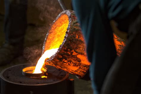 Molten Bronze Poured Into Mold By Melter In Foundry Workshop Rt Nelson Sculpture Awards
