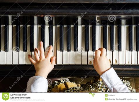 Cute Little Girl Playing Grand Piano In Music School Stock Image