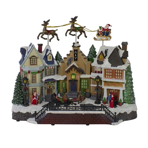 16 White And Brown Led Lighted And Animated Christmas Village With