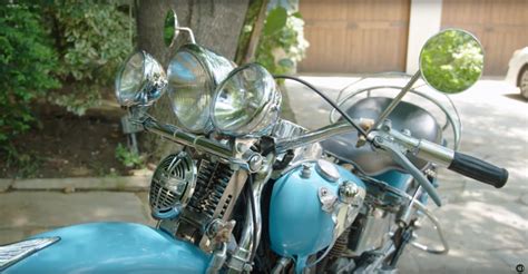 Theres A Light Blue Motorcycle Parked Out Front John Stamoss