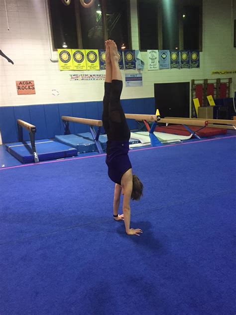 On an exhale with a strong core, press the arms and upper body into the ground and lift the legs up overhead, moving the hips and legs off the floor. The Nerdy Girl's Guide to the Gym: Handstand progress