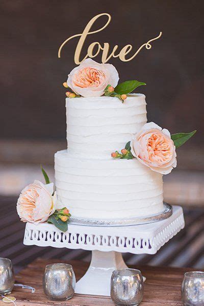 A rustic one tier wedding cake that imitates. Two Tier Blush Flower Topped White Wedding Cake | Wedding ...