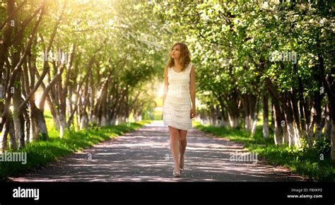 Girl Walking In The Park Stock Photo Alamy