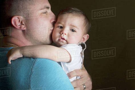 Caucasian Father Kissing Son Stock Photo Dissolve