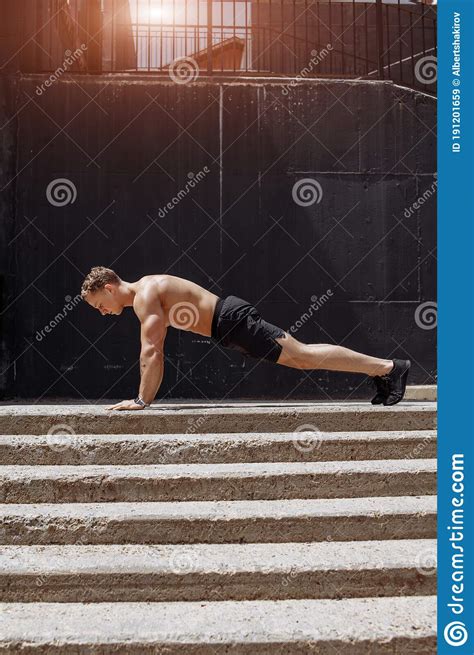 Sportsman Training Push Up Exercise Outdoor On Staircase Stock Image