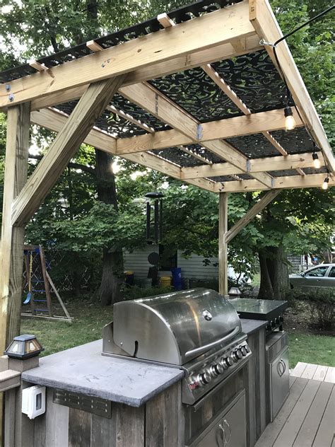 Cantilevered Pergola With Decorative Pvc Lattice Over Outdoor Kitchen