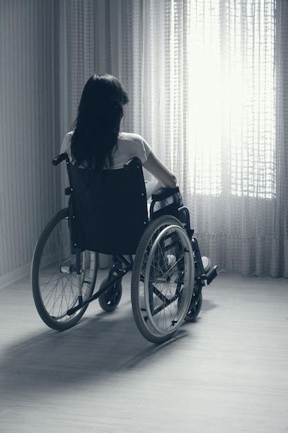 premium photo sad woman sitting on wheelchair