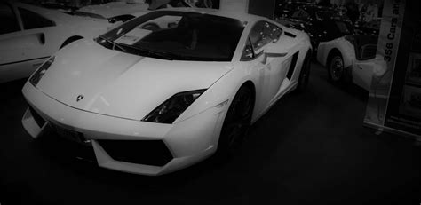 Download Captivating Black And White Car Photography Wallpaper