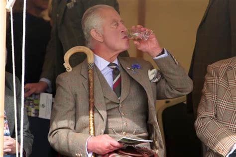 King Charles Enjoys A Wee Dram At Highland Games