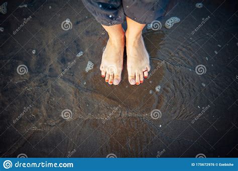 Woman S Feet On Sandy Beach Standing In Ocean Water Copy Space
