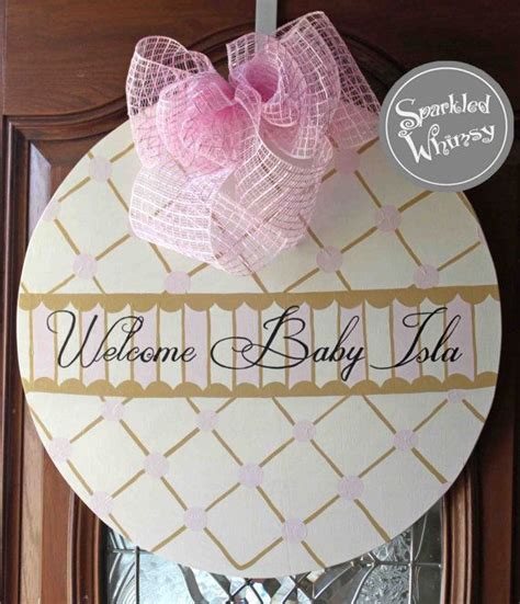 This Personalized Hand Painted Wooden Door Hanger Welcomes Your New