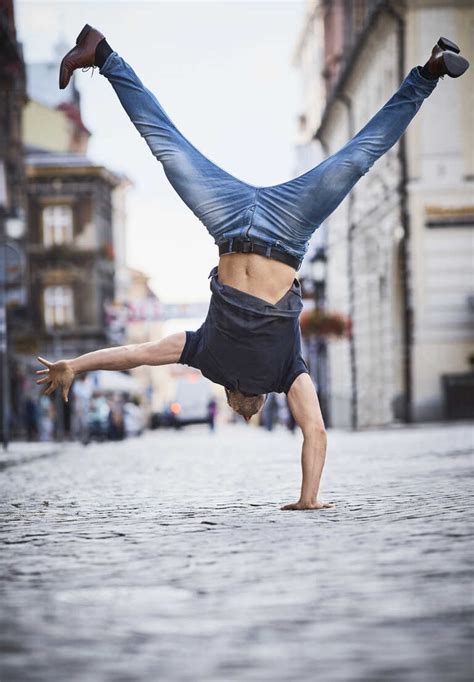 Man Doing A Handstand In The City Stock Photo