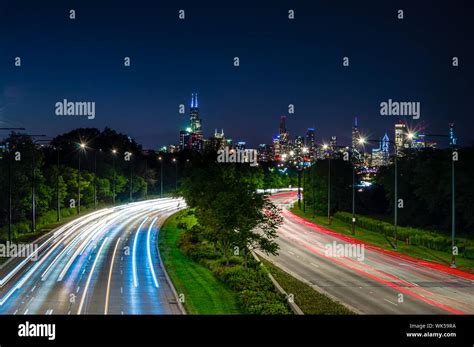 Lights In The City At Night Skyline And Traffic On The Streets Of
