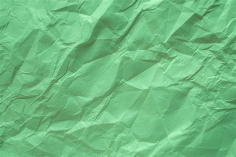 Premium Photo Green Crumpled Paper Close Up Texture Background Luzes De Fundo Papel