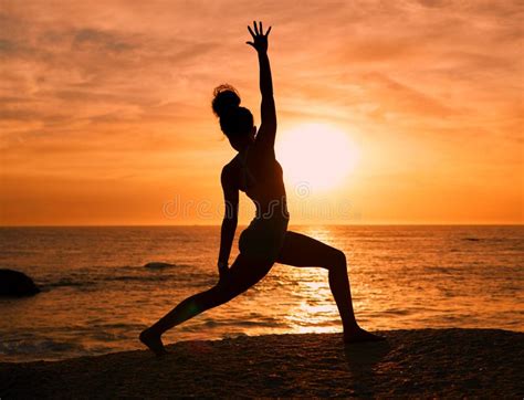 Yoga Exercise And Silhouette Of Woman On Beach At Sunrise For Fitness