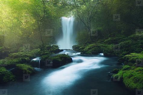 Landscape Of Beautiful Scenery Of Waterfall In Deep Forest Backg Stock