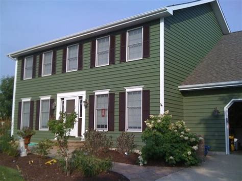 Paint stores can help with colors and quantities. Exterior Painting - Green two story traditional home with ...
