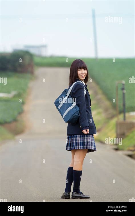 Female High School Student Standing On Rural Road Stock Photo Alamy