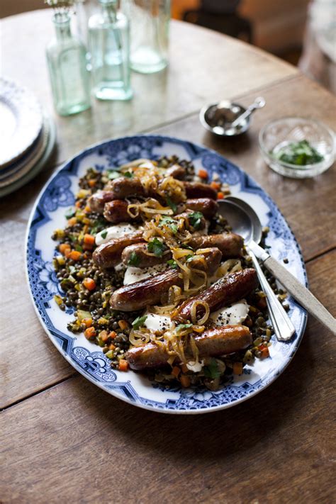 Lamb Sausages With Spiced Lentils Caramalised Onions And Crème Fraîche