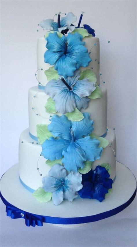 Many wedding florists use specially designed holders when placing flowers on the cake. Hibiscus wedding cake | Floral cake, Wedding cakes, Cake