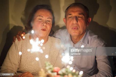 Older Man Blowing Out Candles Photos And Premium High Res Pictures Getty Images