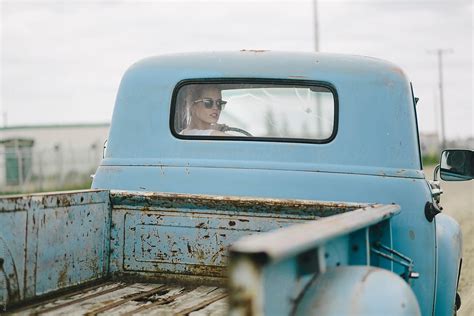 Blond Girl Driving An Old Pickup Truck By Stocksy Contributor A