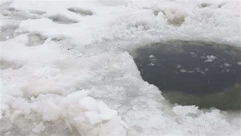 Covered With Ice And Snow Pond With Ice Hole On A Winter Day Stock