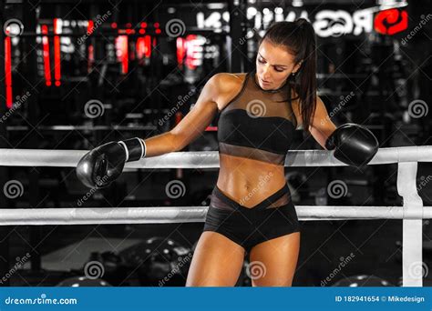 Woman Boxer In The Ring In The Gym Young Athlete In Boxing Gloves Getting Ready For Fight