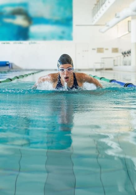 Premium Photo Fit Swimmer Doing The Butterfly Stroke In The Swimming Pool