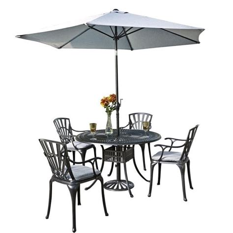 Includes table, umbrella and 4 chairs. Hawthorne Collections 6 Piece Patio Dining Set with ...