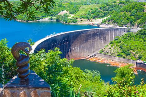 Lake Kariba Dam Wall And A Statue Of Nyami Nyami The River Snake God