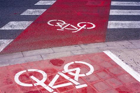 Signs And Bike Lane Markings Painted On The Asphalt Of The Streets Of