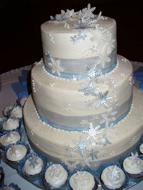 Silver And Blue Snowflake Wedding Cake With Cupcakes Snowflake