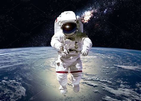Astronaut In Outer Space Featuring Earth Planet And Cosmos Space