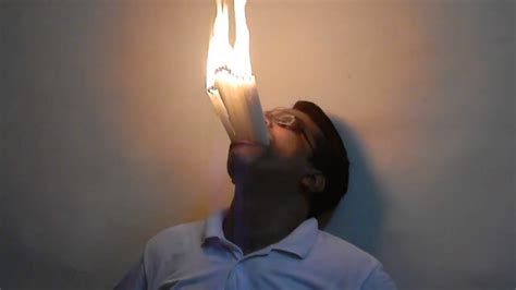 Man Holds 22 Lit Candles In Mouth Youtube