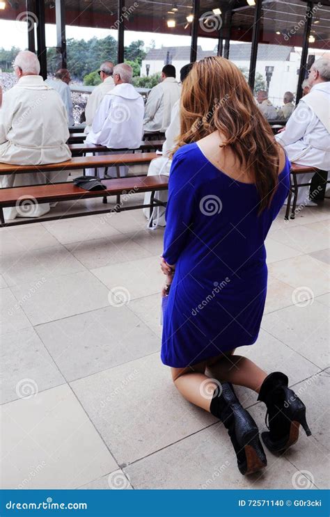 Woman Praying On Her Knees
