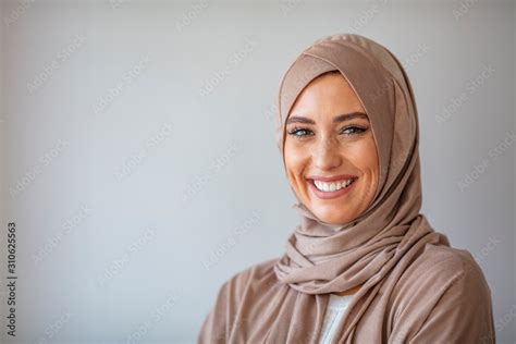 Woman In Traditional Muslim Clothing Smiling Woman Headshot Looking At Camera And Wearing A