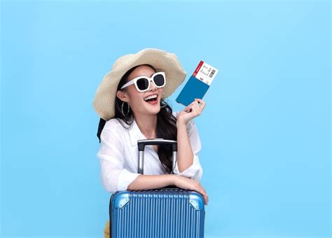 Premium Photo Happy Young Asian Tourist Woman Holding Passport And