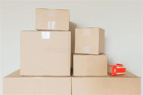 Variety Of Packed Moving Boxes In Empty Room Stock Image Image Of