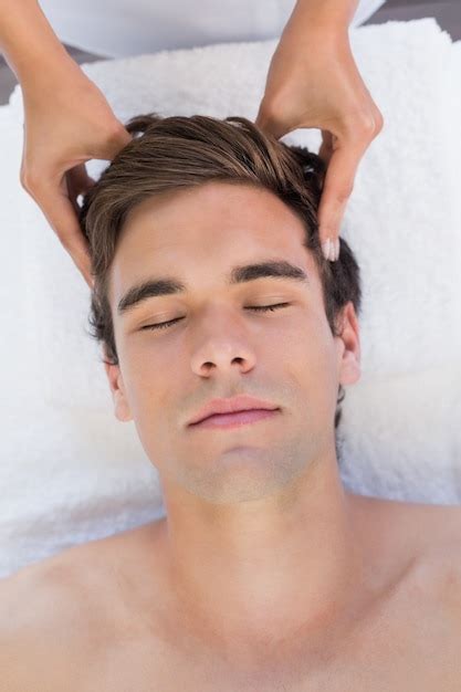 Premium Photo Man Receiving Head Massage At Spa Center