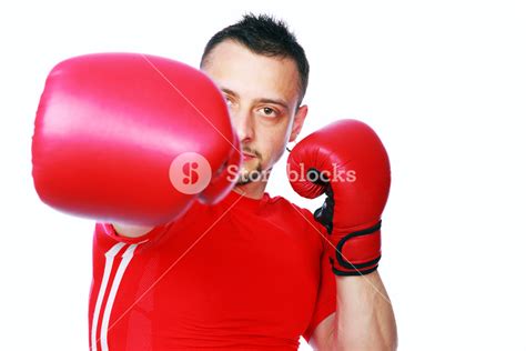 Fitness Man Punching With Red Boxing Gloves Isolated On White
