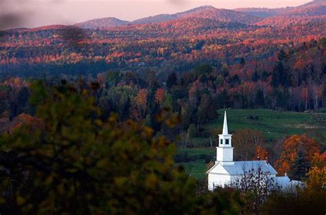 Church Steeples Nestled In The Hills Peeking Over The Tops Of Trees