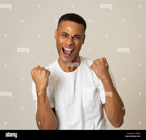 Portrait Of Amazed Excited African American Man Achieving His Goal Or